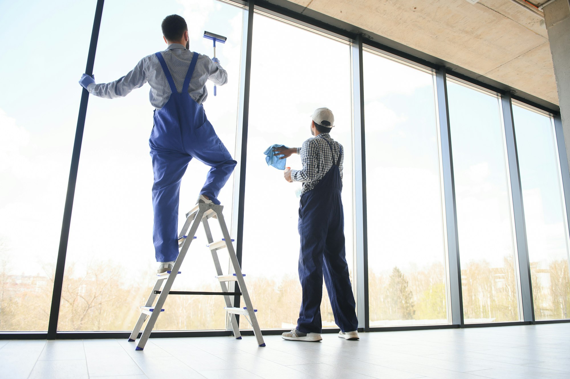 A man cleaning windows. cleaning team of men washes the windows