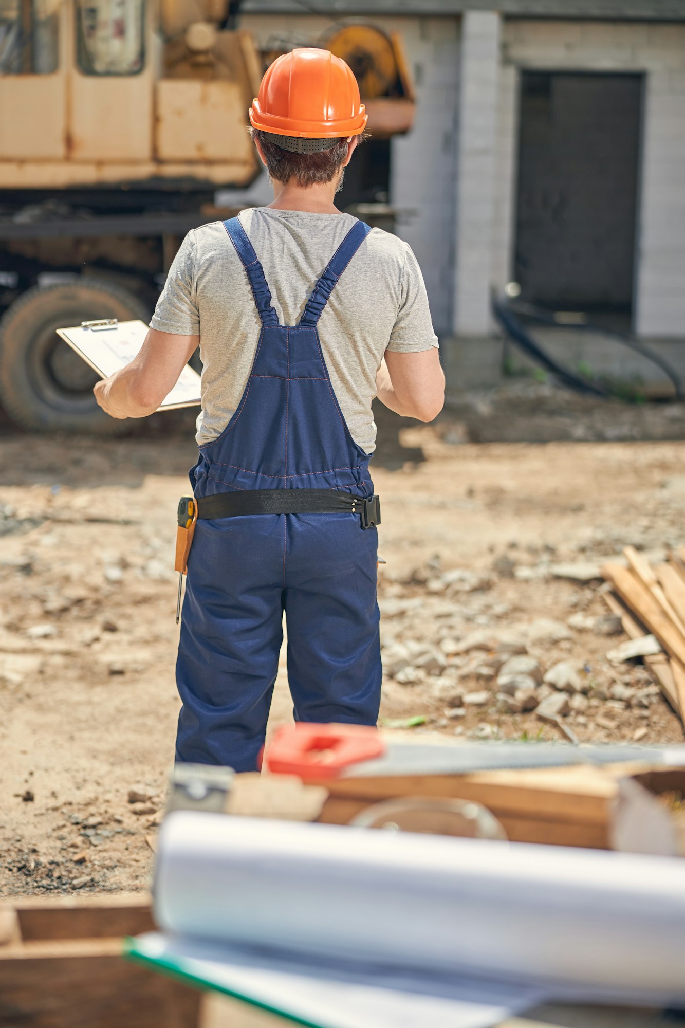 Man in a helmet looking at a vehicle